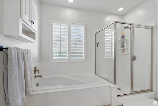 722 N Meridian Dr, Saratoga Springs, UT 84045 - bathroom with a bath, a shower stall, and recessed lighting