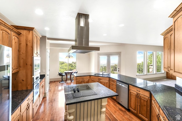 1596 E Millbrook Way S, Bountiful, UT 84010 - kitchen with island range hood, appliances with stainless steel finishes, a sink, wood finished floors, and plenty of natural light
