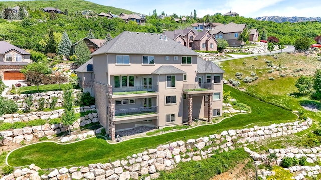 1596 E Millbrook Way S, Bountiful, UT 84010 - rear view of property with stucco siding, a balcony, a mountain view, and a residential view