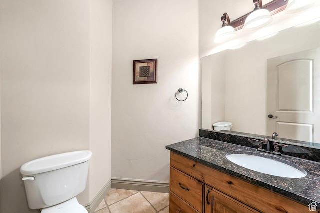 1596 E Millbrook Way S, Bountiful, UT 84010 - half bathroom featuring toilet, vanity, tile patterned flooring, and baseboards