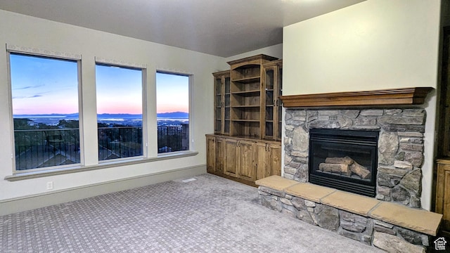 1596 E Millbrook Way S, Bountiful, UT 84010 - unfurnished living room with a fireplace and carpet flooring