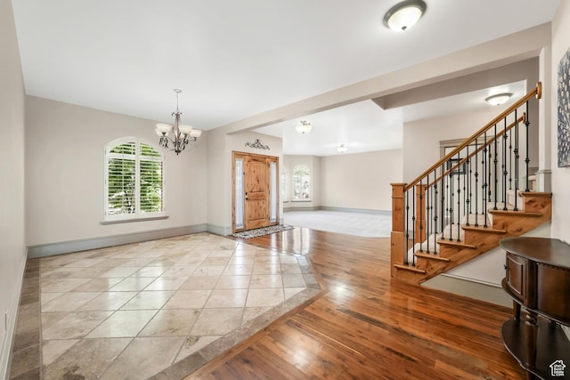 1596 E Millbrook Way S, Bountiful, UT 84010 - entrance foyer with baseboards, a chandelier, stairway, and wood finished floors