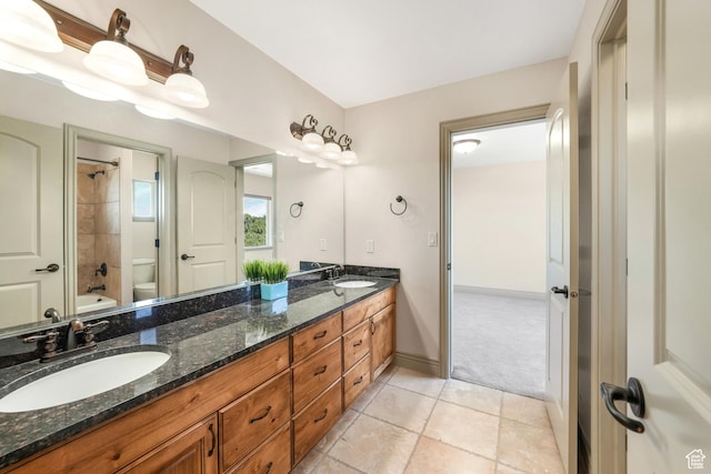 1596 E Millbrook Way S, Bountiful, UT 84010 - bathroom with toilet, double vanity, bathtub / shower combination, tile patterned floors, and baseboards
