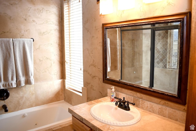 45 Wedge Way, Garden City, UT 84028 - bathroom with a whirlpool tub, vanity, and wallpapered walls