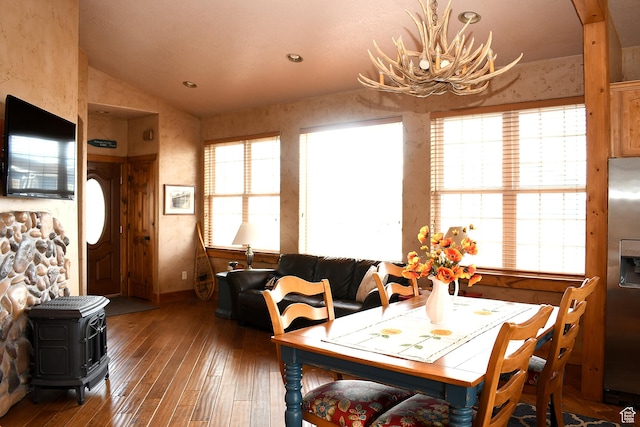45 Wedge Way, Garden City, UT 84028 - dining area featuring vaulted ceiling, hardwood / wood-style floors, and a wood stove