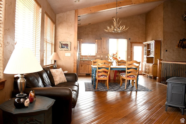 45 Wedge Way, Garden City, UT 84028 - living room featuring a chandelier, vaulted ceiling, and hardwood / wood-style floors