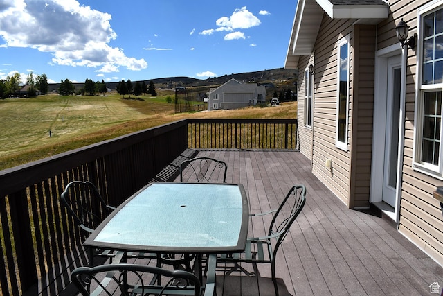 45 Wedge Way, Garden City, UT 84028 - wooden deck featuring a mountain view and outdoor dining space