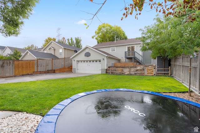 3355 E Golden Eagle Rd, Eagle Mountain, UT 84005 - back of property with an attached garage and an outbuilding
