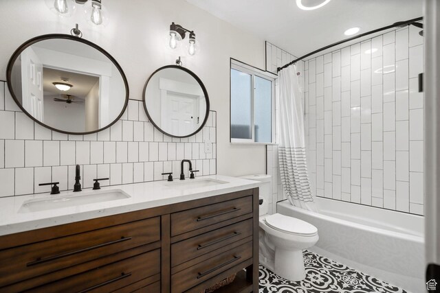 3355 E Golden Eagle Rd, Eagle Mountain, UT 84005 - full bathroom featuring double vanity, shower / bath combo with shower curtain, toilet, backsplash, and tile patterned flooring