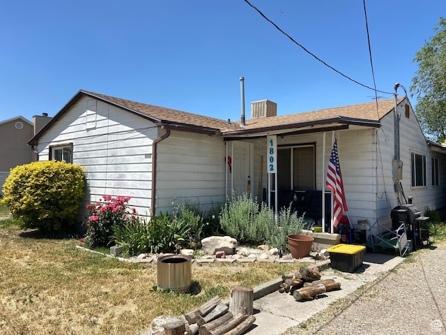 1802 W 5000 S, Taylorsville, UT 84129 - ranch-style home with central air condition unit and a shingled roof