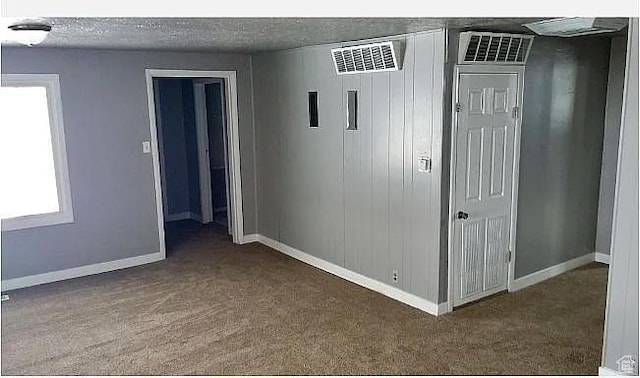 1802 W 5000 S, Taylorsville, UT 84129 - carpeted empty room with baseboards, healthy amount of natural light, and a textured ceiling