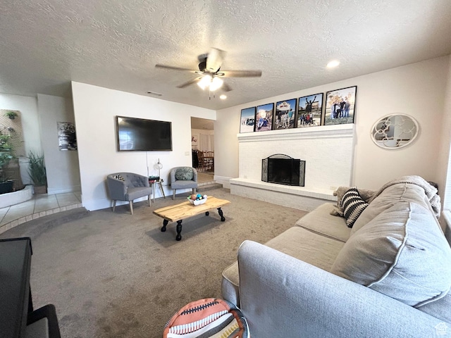 344 E Vermillion Ave, St George, UT 84790 - carpeted living area with a ceiling fan, a fireplace, baseboards, a textured ceiling, and recessed lighting