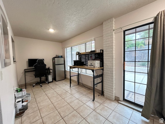 344 E Vermillion Ave, St George, UT 84790 - office space featuring a textured ceiling, light tile patterned floors, and baseboards