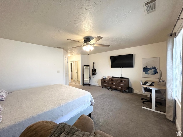 344 E Vermillion Ave, St George, UT 84790 - carpeted bedroom with a textured ceiling, ceiling fan, and baseboards