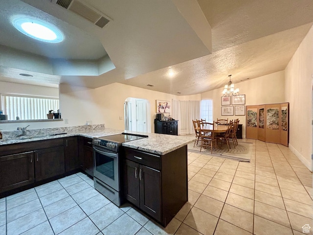 344 E Vermillion Ave, St George, UT 84790 - kitchen featuring stainless steel electric range, a peninsula, light tile patterned floors, light stone counters, and a chandelier