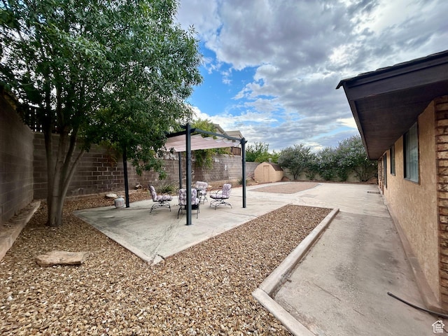 344 E Vermillion Ave, St George, UT 84790 - fenced backyard featuring a patio area
