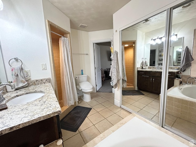 344 E Vermillion Ave, St George, UT 84790 - full bathroom with two vanities, a bath, a shower with curtain, tile patterned floors, and toilet