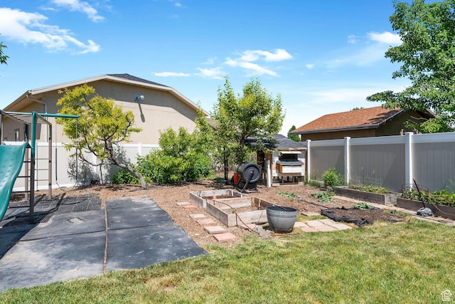 892 W Mattea, Springville, UT 84663 - fenced backyard featuring a vegetable garden and a patio area