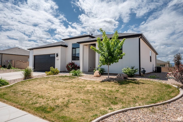 4657 W 275 N, Cedar City, UT 84720 - view of front of property featuring driveway, cooling unit, an attached garage, and a front lawn