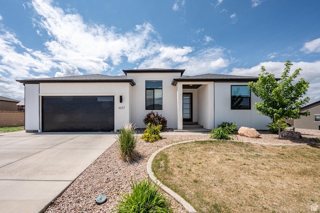 4657 W 275 N, Cedar City, UT 84720 - prairie-style house featuring driveway, an attached garage, and a front lawn