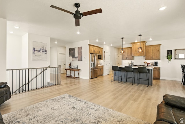 4657 W 275 N, Cedar City, UT 84720 - living area with recessed lighting, a ceiling fan, light wood finished floors, and baseboards
