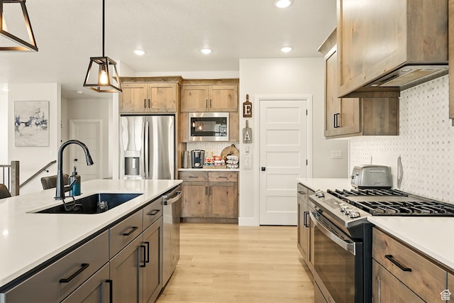 4657 W 275 N, Cedar City, UT 84720 - kitchen featuring appliances with stainless steel finishes, a sink, light wood-type flooring, light countertops, and recessed lighting