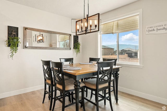 4657 W 275 N, Cedar City, UT 84720 - dining space with a chandelier, wood finished floors, and baseboards
