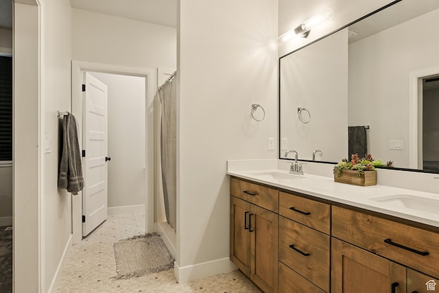 4657 W 275 N, Cedar City, UT 84720 - bathroom with double vanity, baseboards, and a shower with shower curtain