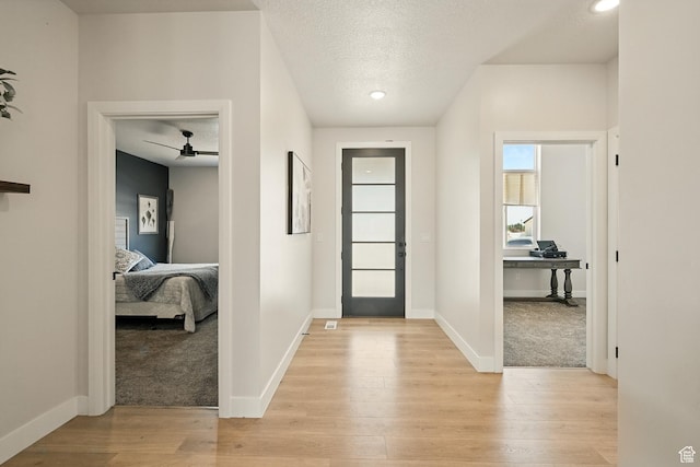 4657 W 275 N, Cedar City, UT 84720 - foyer entrance featuring light wood-style flooring, ceiling fan, a textured ceiling, baseboards, and recessed lighting