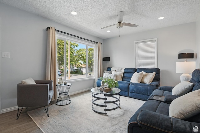 8757 W Helen Dr, Magna, UT 84044 - living area with wood finished floors, a ceiling fan, baseboards, recessed lighting, and a textured ceiling