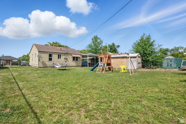 8757 W Helen Dr, Magna, UT 84044 - back of property with a playground and a yard