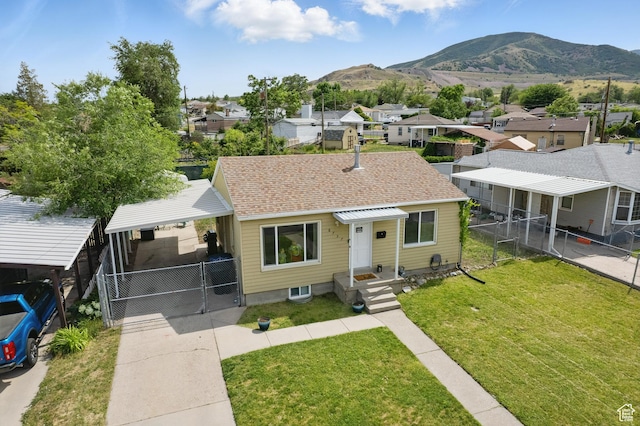 8757 W Helen Dr, Magna, UT 84044 - bungalow-style home featuring a residential view, a mountain view, a gate, and a shingled roof