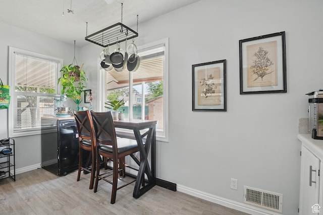 8757 W Helen Dr, Magna, UT 84044 - dining room featuring light wood-style floors and baseboards