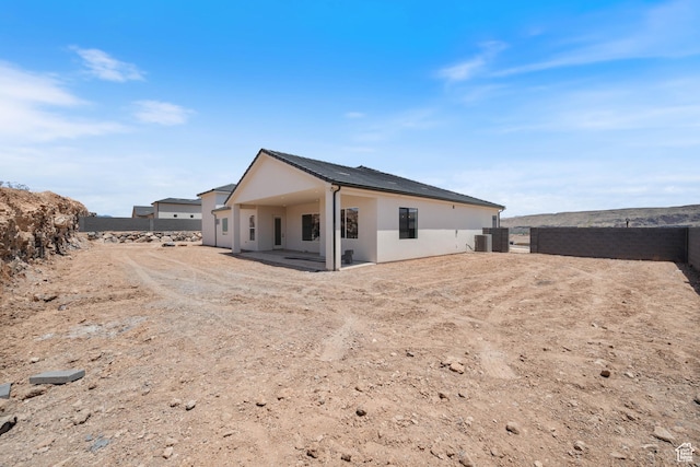 824 S 1690 W, Hurricane, UT 84737 - rear view of property featuring cooling unit, stucco siding, and a patio area