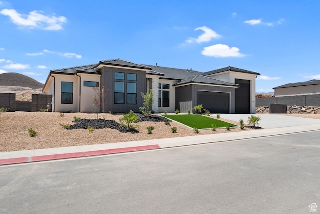 824 S 1690 W, Hurricane, UT 84737 - view of front of house featuring an attached garage, driveway, and a tile roof