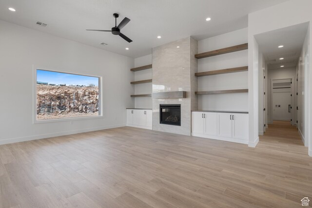 824 S 1690 W, Hurricane, UT 84737 - unfurnished living room with ceiling fan, light wood-style floors, a tile fireplace, recessed lighting, and baseboards