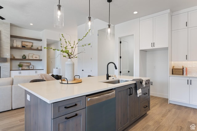 824 S 1690 W, Hurricane, UT 84737 - kitchen featuring dishwashing machine, light wood-type flooring, white cabinetry, light countertops, and a kitchen island with sink