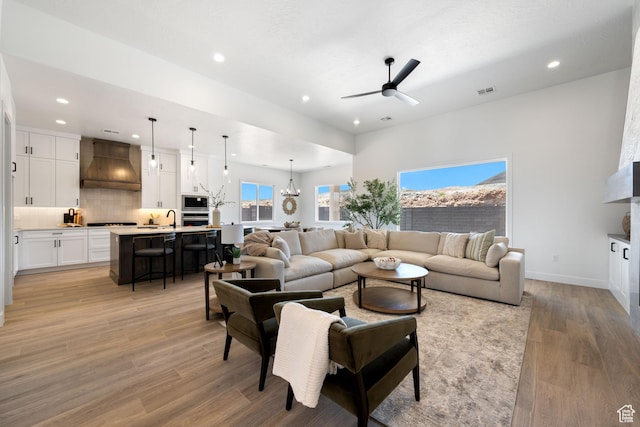 824 S 1690 W, Hurricane, UT 84737 - living area with recessed lighting, light wood finished floors, a ceiling fan, and a chandelier