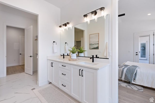 824 S 1690 W, Hurricane, UT 84737 - ensuite bathroom featuring double vanity, recessed lighting, and marble finish floors