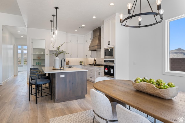824 S 1690 W, Hurricane, UT 84737 - kitchen with appliances with stainless steel finishes, a chandelier, plenty of natural light, a kitchen island with sink, and recessed lighting