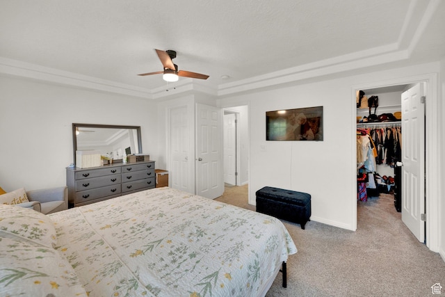 14284 S Daisyfield Dr E, Draper, UT 84020 - bedroom with a tray ceiling, a walk in closet, light carpet, a closet, and ceiling fan