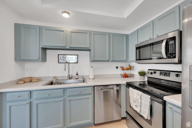 14284 S Daisyfield Dr E, Draper, UT 84020 - kitchen featuring appliances with stainless steel finishes, a sink, and light countertops