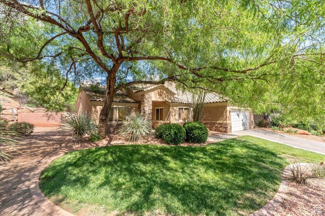 1173 W Snow Canyon Pkwy Unit 30, St George, UT 84770 - view of property hidden behind natural elements with stone siding, concrete driveway, and stucco siding