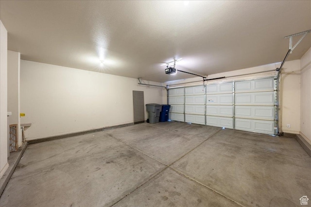1173 W Snow Canyon Pkwy Unit 30, St George, UT 84770 - garage with a garage door opener and baseboards