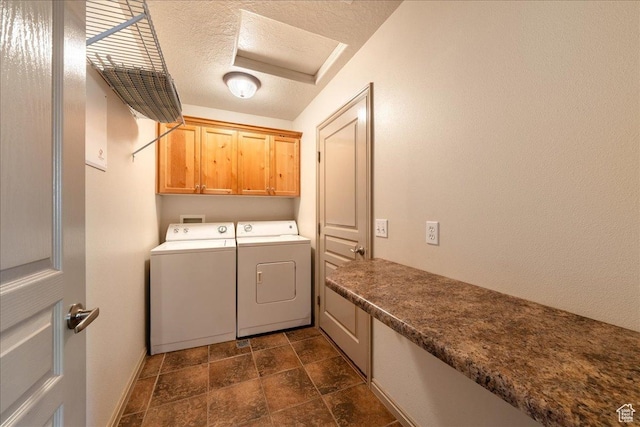 1173 W Snow Canyon Pkwy Unit 30, St George, UT 84770 - laundry room with cabinet space, washing machine and dryer, a textured ceiling, dark stone finish flooring, and baseboards