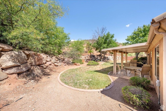 1173 W Snow Canyon Pkwy Unit 30, St George, UT 84770 - view of yard with a patio