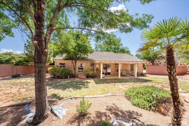1173 W Snow Canyon Pkwy Unit 30, St George, UT 84770 - back of property with stucco siding, a patio area, and a tiled roof