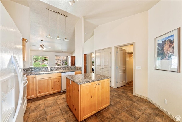 1173 W Snow Canyon Pkwy Unit 30, St George, UT 84770 - kitchen with white appliances, a kitchen island, a sink, ceiling fan, and light brown cabinetry