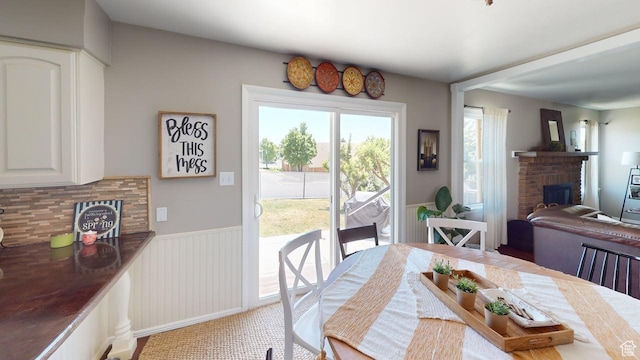 540 E 990 N, Pleasant Grove, UT 84062 - carpeted dining area with a fireplace and wainscoting