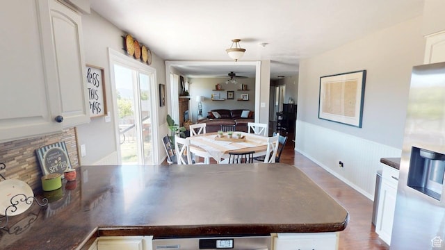 540 E 990 N, Pleasant Grove, UT 84062 - dining area featuring ceiling fan, wood finished floors, and a wainscoted wall